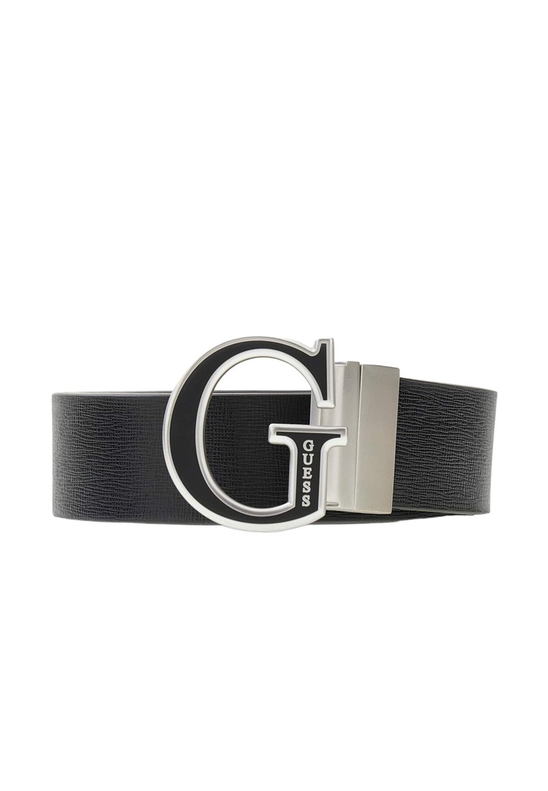 Ceinture en similicuir noir avec une grande boucle "G" argentée, accent noir et le mot "GUESS" gravé à la base.