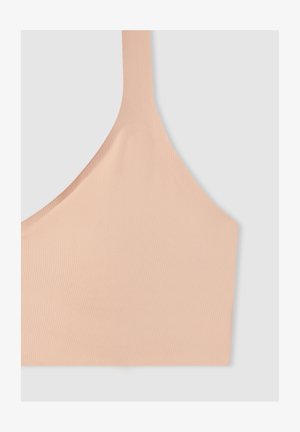 Soutien-gorge sport color pesca con una consistenza morbida e liscia, spalline larghe e un design minimalista. Realizzato in tessuto elastico e traspirante.