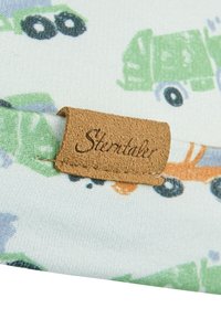Cotton fabric featuring a light blue background with colorful truck patterns in green, orange, and blue; includes a brown leather tag with "Sterntaler."
