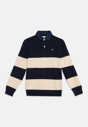 Tricou de rugby cu mâneci lungi, cu dungi orizontale bleumarin și bej și guler bleumarin cu doi nasturi.