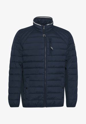 Tumes sinine polsterdatud jakk kõrge krae, täispikk luku, kahe küljetasku ja tikandime tekstuuriga. Omab heledat halli aksenti.