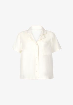 Korte mouwen, crèmekleurig shirt van zachte stof, met een kraag, knoopsluiting en een voorzak aan de linkerkant.