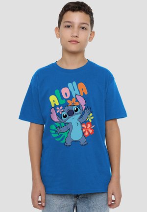 Blue cotton t-shirt featuring a cartoon character with large ears and eyes, surrounded by colorful text and tropical flower graphics.