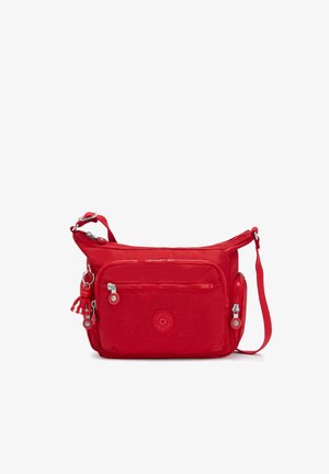 Bolso cruzado rojo fabricado con tela duradera, con un compartimento principal con cremallera, bolsillo frontal y un emblema de logo. Incluye una correa ajustable.