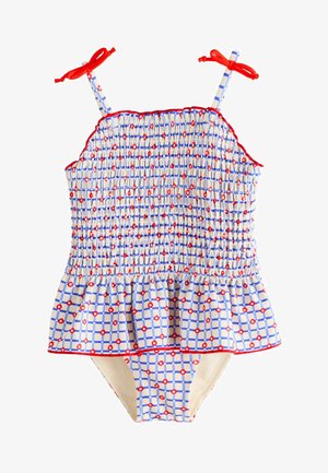 Maillot de bain à carreaux bleus et blancs avec accents rouges, corsage smocké et basque à volants. Haut à bretelles noué avec des nœuds rouges aux épaules.