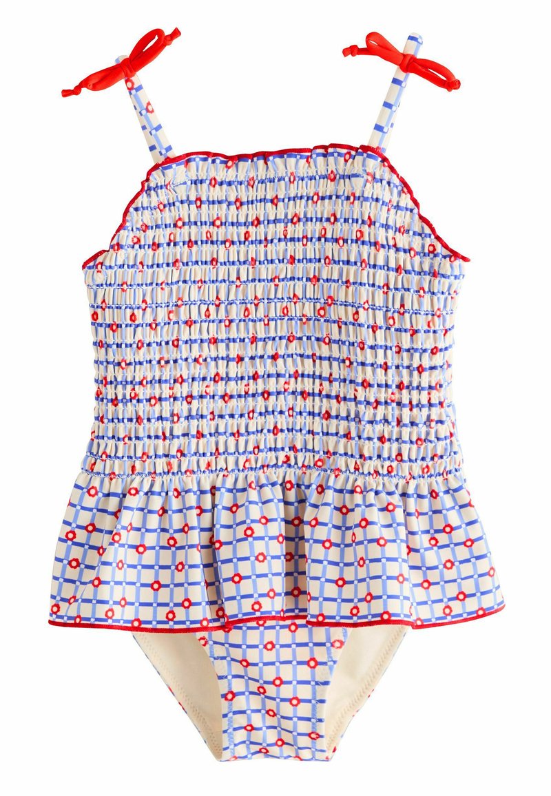 Blau-weiß karierten Badeanzug mit roten Akzenten, gerafftem Oberteil und ausgestelltem Rüschensaum. Das Trägertop wird an den Schultern mit roten Schleifen gebunden.