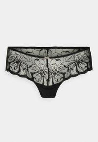 Svart spetsstring med blommönsterbroderi, genomskinlig meshdesign, vågiga kanter, en solid tygframsida och en dekorativ detalj i guldton.