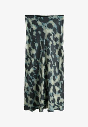 Leopard print skirt featuring a flowing design, made from lightweight fabric, with shades of black, cream, and green. Hem is slightly flared.