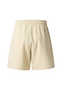 Kremowe szorty wykonane z miękkiego materiału, z elastycznym pasem i luźnym krojem, z prostym obszyciem na krawędziach.