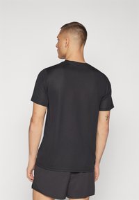 Puma PERFORMANCE TEE - Camiseta deportiva - black