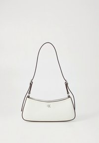 White leather shoulder bag with brown accents, curved shape, and silver logo at the front. Single thin shoulder strap for carrying.
