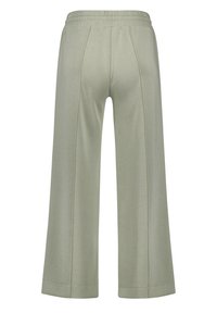 Light green wide-leg pants made from soft fabric, featuring a stretchy waistband and sewn in pleats for added texture and detail.