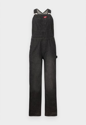Schwarzer Jeans-Latzhose mit verstellbaren Schultergurten, einer vorderen Brusttasche und lockerem, geradem Beinverlauf.