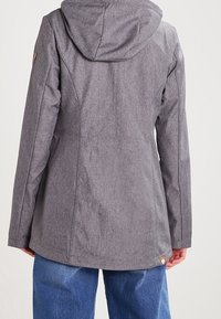 Gray weather-resistant jacket with a hood, featuring a textured surface and a logo accent on the lower side. Fitted silhouette.