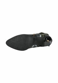 Scarpa nera con tacco, punta affusolata, suola in gomma testurizzata e parte superiore in tessuto a motivo floreale con cuciture colorate a contrasto.
