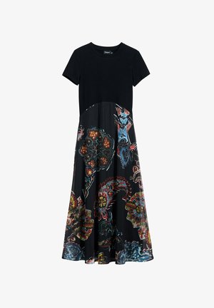 Schwarzes Kleid mit kurzen gerippten Ärmeln, das ein blumiges Paisleymuster in lebendigen Farben auf einem fließenden Rock zeigt. Materialkontraste zwischen Oberteil und Unterteil.