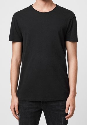 Schwarzes kurzärmeliges T-Shirt aus Baumwolle. Verfügt über einen Rundhalsausschnitt und eine entspannte Passform. Glatte Textur, keine sichtbaren Muster oder Akzente.