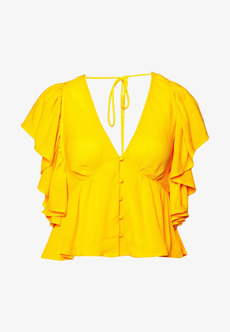 Blouse jaune manches courtes avec un décolleté profond en V, boutons recouverts de tissu sur le devant, manches volantées et fermeture à nouer dans le dos au niveau du col.