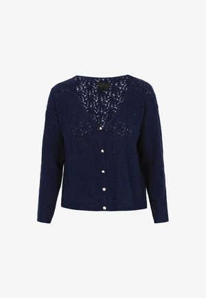 Jūras zila adīta kardigāna ar V veida kaklu, garām piedurknēm un dekoratīvām pogām priekšā. Rāda mežģīņu rakstu augšējā daļā.