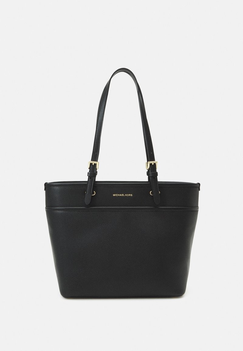 Sac cabas en cuir noir Michael Kors avec deux bretelles ajustables et des détails de boucle dorée sur fond blanc.