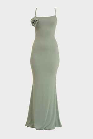 Rochie maxi de culoare verde mentă, ajustată, cu decolteu drept și bretele subțiri. Are un detaliu cu volane pe umărul stâng. Material moale și neted.