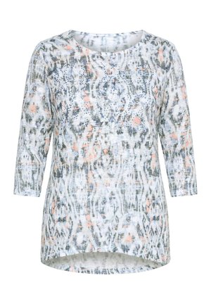 Camisa de mujer de manga larga con escote redondo, patrón abstracto gris y melocotón y pequeños tachones decorativos en la parte delantera.