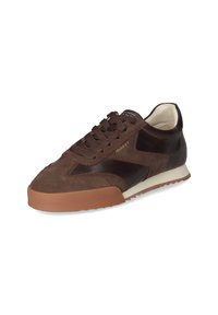 Brown suede sneaker with leather accents, rounded toe, and brown rubber sole. Features lace closure and logo on tongue.