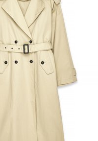 Beige trench coat featuring a double-breasted design, large lapels, a belt with a rectangular buckle, and flap pockets with black buttons.