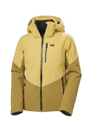 Chaqueta de exterior amarilla y marrón con cierre a cremallera, capucha y acentos negros. Presenta un diseño de bloque de color geométrico y un forro interior texturizado.