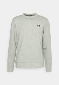 Light gray sweatshirt made of soft fabric, featuring a round neck, long sleeves, black logo on the chest, and black accents on the sides.