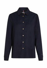 Camicia a maniche lunghe blu navy con chiusura frontale a bottoni, bottoni dorati, colletto e polsini. Realizzata in un tessuto liscio con una vestibilità classica.