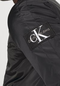 Calvin Klein Jeans Giacca da mezza stagione - black
