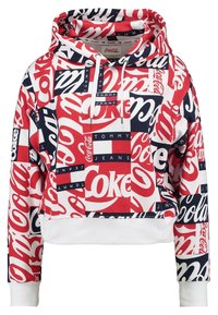 Sweat à capuche présentant un motif rouge, blanc et marine composé de logos et de textes Coca-Cola. Confectionné en tissu doux avec une coupe courte et des poignets côtelés.
