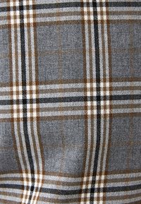 Gray fabric featuring a check pattern with brown, black, and white lines. Texture appears smooth with a tight weave.
