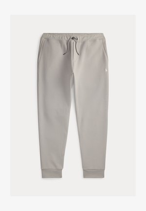 Šedé tepláky vyrobené z měkké látky, se stahovací šňůrkou v pase, bočními kapsami a žebrovanými manžetami. Obsahují malé logo na stehně.