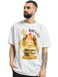 Valge lühikeste varrukatega t-särk, millel on värvikas graafika stiliseeritud peast ja hamburgerist koos tekstiga "EAT LIT!" ning kaktuse aktsentidega.
