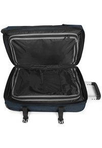 Grey and blue suitcase with a large open compartment, black interior, zippered pocket, mesh storage, and retractable handle.