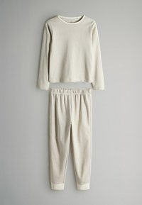 Langärmliges gestreiftes Oberteil und passende Hose in Beige und Hellgrau, mit rundem Halsausschnitt und elastischem Bund. Weiches, strukturiertes Gewebe.