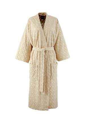 Peignoir beige texturé à manches longues, avec deux poches avant et une ceinture assortie nouée à la taille.