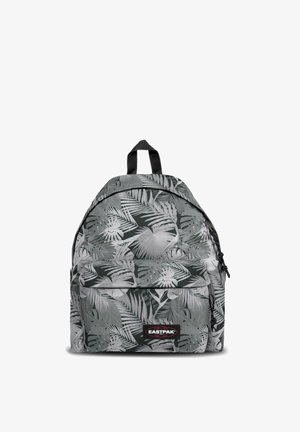 Sac à dos avec motif de feuilles tropicales noir et blanc, poche zippée à l'avant et poignée de transport supérieure, marque Eastpak sur la poche.