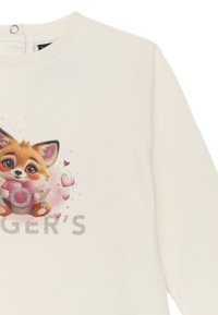 Felpa color crema con un fumetto di una volpe che tiene un cuore, con lettere argentate e piccoli strass decorativi attorno al design.