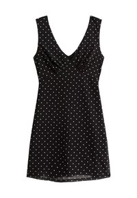 Robe noire à pois blancs, sans manches, décolleté en V, tissu froncé au niveau de la poitrine, ourlet au genou. Texture lisse.