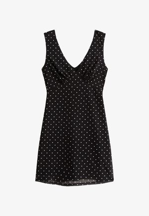 Zwarte jurk met witte stippen, mouwloos ontwerp, V-hals, bijeen geraapt stof bij de buste, knie-lange zoom. Gladde textuur.