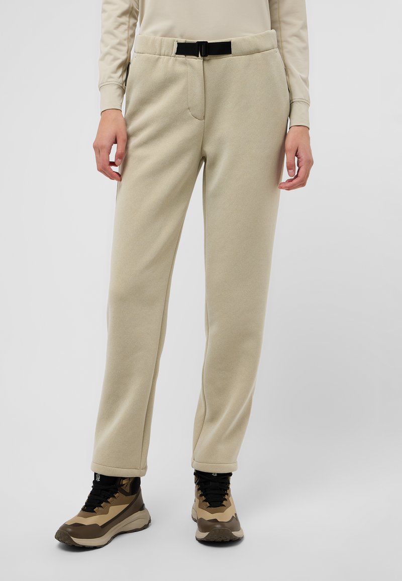 Pantalons de jogging en polaire doux couleur beige, avec une taille ajustée et des poches avant, dotés d'une ceinture noire réglable et d'une coupe droite.