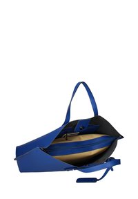 Sac à main en cuir bleu à la forme ouverte, avec un intérieur beige contrastant, une poche zippée et deux poignées. Texture lisse et lignes épurées.