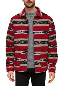 Red, black, and beige patterned jacket with a button-up front, two front pockets, and a collar. Made from a soft, textured fabric.