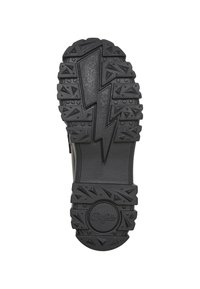 Semelle noire de botte avec un motif d’éclair et des crampons triangulaires en relief, avec le nom de la marque "Buffalo" près du talon.