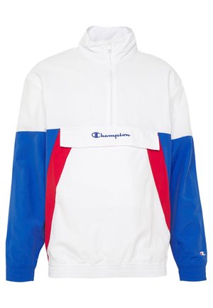 Veste à enfiler Champion bicolore blanc, bleu et rouge, avec demi-fermeture éclair et logo sur le rabat de la poche avant et sur le poignet de la manche gauche.