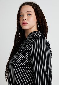 ONLY Carmakoma CARANITA SHIRT - Blouse - black/white