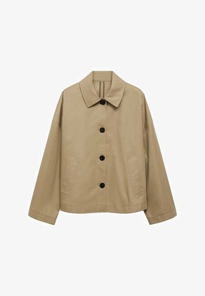 Beige jacket with a classic collar, black buttons, two side pockets, and a loose fit. Made from a smooth fabric with a slightly matte finish.